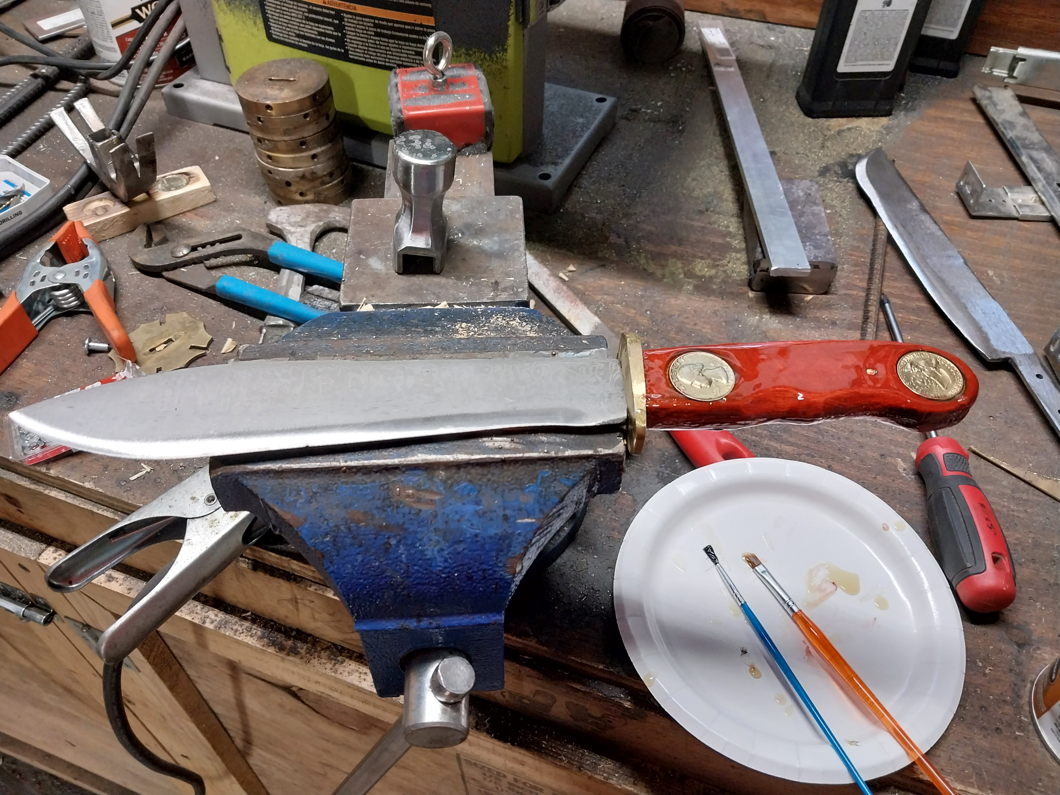  200 layer damascus made of 1095 and 15N20. African mahogany handle with inlaid bicentinial quarters.
